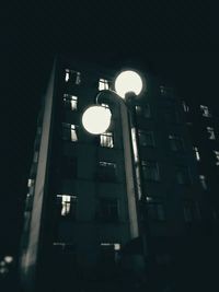 Low angle view of illuminated building at night