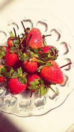 High angle view of strawberries in plate on table