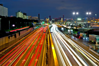 High angle view of light trails on road at night