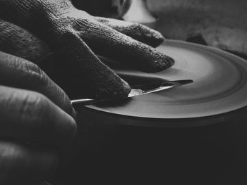 Close-up of person sharpening knife