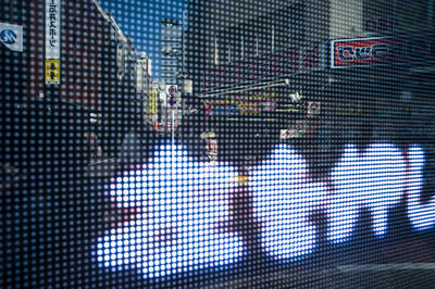 Reflection of sky seen through chainlink fence