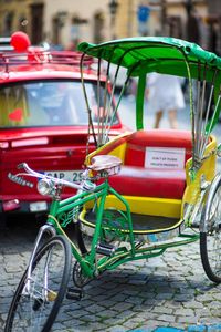 Bicycle rickshaw parked on cobblestone 