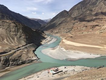 Scenic view of snowcapped mountains against sky and river