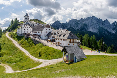 Scenic view of houses and buildings against sky