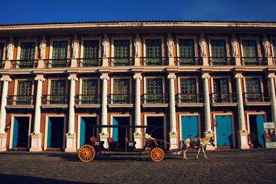 Bicycles on street against building