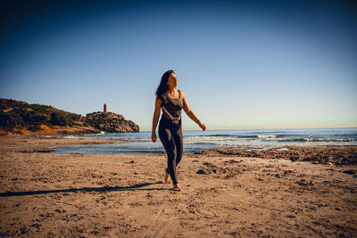 Girl walking on the beach