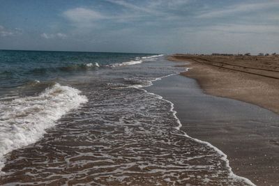 Scenic view of beach against sky