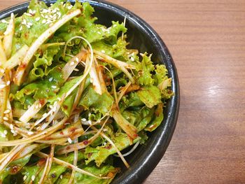 High angle view of chopped vegetables in bowl on table