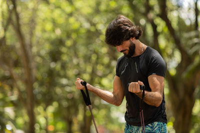 Man running and jogging at a park outdoors. male person workout. feel good, healthy concept. 