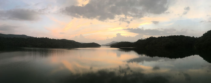 Scenic view of lake against sky during sunset