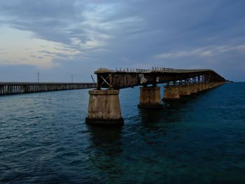 Pier over sea against sky