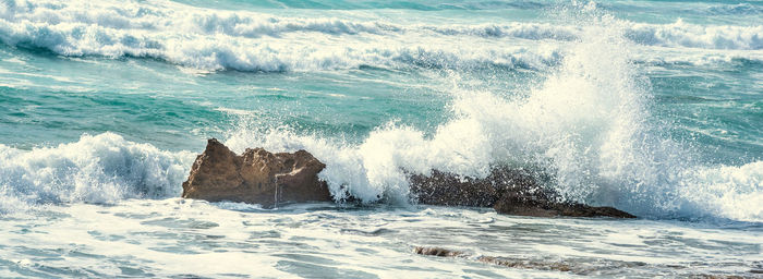 Waves splashing on shore