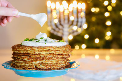 Close-up of hand holding cake