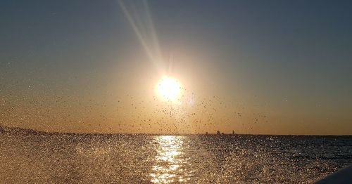 Scenic view of sea against sky at sunset