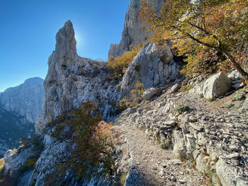 Low angle view of rock formation against sky