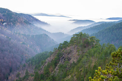 Hills above clouds viewed from a mountain top