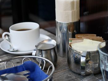 Close-up of coffee cups on table in restaurant