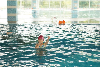 Low section of woman in swimming pool