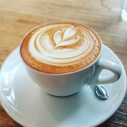 Close-up of cappuccino on table