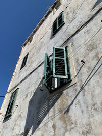 Low angle view of old building against clear sky