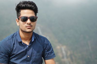 Portrait of young man wearing sunglasses