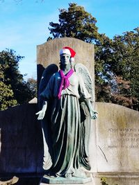 Low angle view of statue against sky