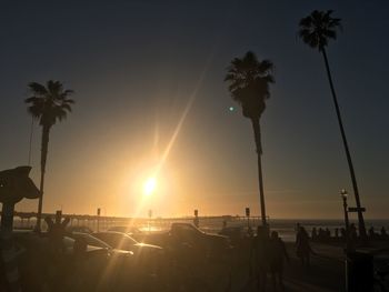 People at beach during sunset