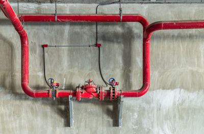 Red pipe against wall
