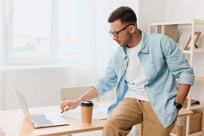 Doctor working at desk in office