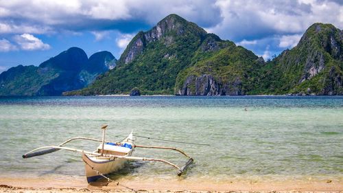 Scenic view of sea against mountains