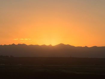 Scenic view of silhouette landscape against sky during sunset