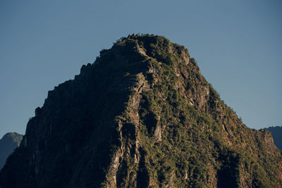 Low angle view of rock formation against sky