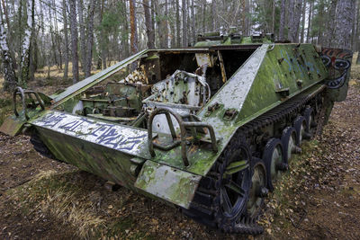 Abandoned vintage car on field