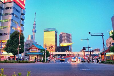 City street and buildings against blue sky