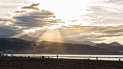 Scenic view of sea against cloudy sky