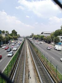 High angle view of railroad tracks by street in city