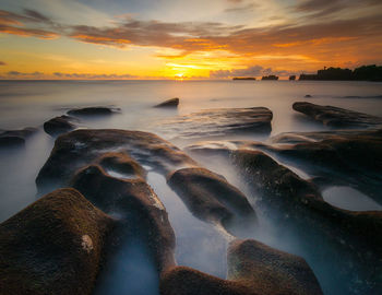 Scenic view of sea against sky during sunset