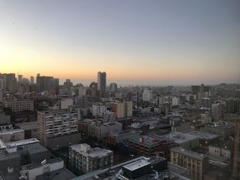 High angle view of buildings against sky during sunset