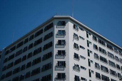 Low angle view of building against clear blue sky