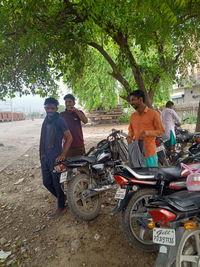 People riding motorcycle on street in city