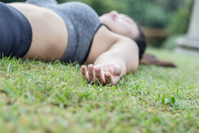 Surface level of woman lying on land
