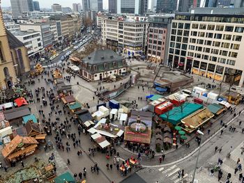 High angle view of people walking on city street