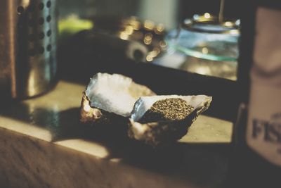 Close-up of cigarette on table