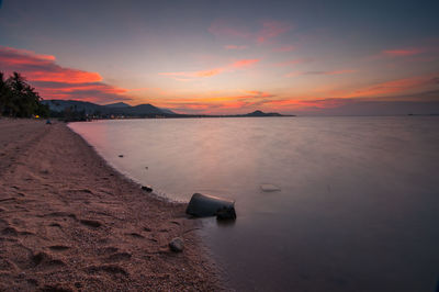 Scenic view of sea at sunset