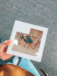 Low section of woman holding food