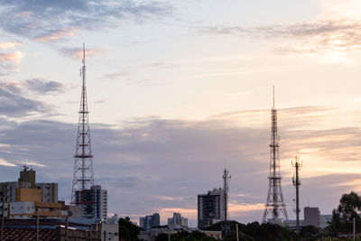 Low angle view of buildings against sky during sunset