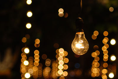 Close-up of illuminated light bulb