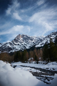 Scenic view of snowcapped mountains against sky