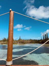 Low angle view of pole against blue sky