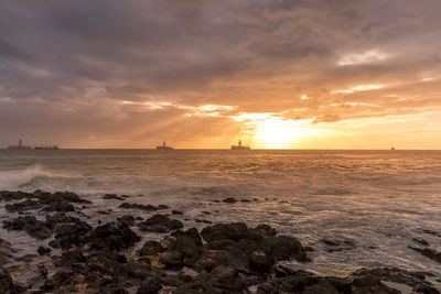 Scenic view of sea against sky during sunset